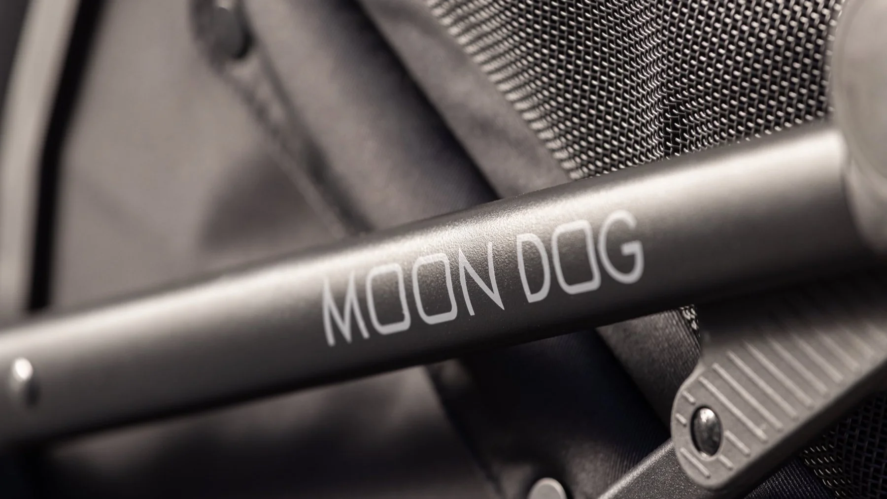 Close-up of the MOON Dog pet stroller frame with the MOON DOG lettering